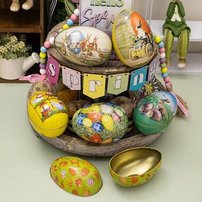 A collection of colorful Easter eggs with decorative patterns, arranged on a wooden stand, featuring a tinplate box with a golden interior.
